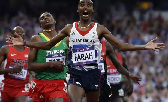 FILE - Britain's Mohamed Farah celebrates as he crosses the finish line to win the men's 5000-meter final during the athletics in the Olympic Stadium at the 2012 Summer Olympics, London, Saturday, Aug. 11, 2012. (AP Photo/Anja Niedringhaus, File)
