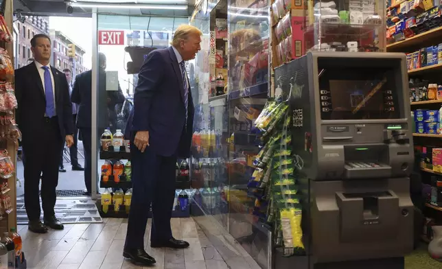 Former President Donald Trump talks with bodega owner Maad Ahmed during a visit to his store, Tuesday, April 16, 2024, in New York. Fresh from a Manhattan courtroom, Donald Trump visited a New York bodega where a man was stabbed to death, a stark pivot for the former president as he juggles being a criminal defendant and the Republican challenger intent on blaming President Joe Biden for crime. (AP Photo/Yuki Iwamura)