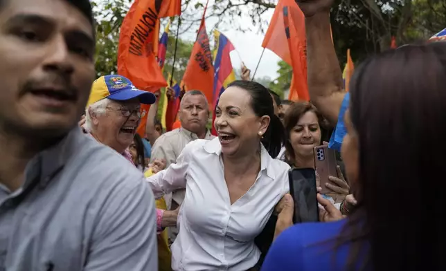 Opposition leader and presidential hopeful Maria Corina Machado, who is banned from running for office, attends a rally where she asked supporters to keep the faith, in San Antonio, Venezuela, April 17, 2024. (AP Photo/Ariana Cubillos)