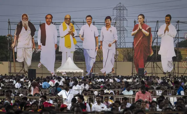 Large cutouts representing Dravida Munnetra Kazhagam and Indian National Congress leaders, tower over supporters during an election campaign rally, on the outskirts of southern Chennai, India, April 15, 2024. Millions of Indians will begin voting in a six-week election that's a referendum on the populist prime minister who has championed a brand of Hindu nationalist politics and is seeking a rare third term as the country's leader. (AP Photo/Altaf Qadri)