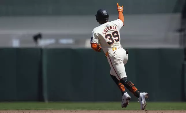 San Francisco Giants' Thairo Estrada runs the bases after hitting a solo home run against the Pittsburgh Pirates during the third inning of a baseball game Sunday, April 28, 2024, in San Francisco. (AP Photo/Godofredo A. Vásquez)