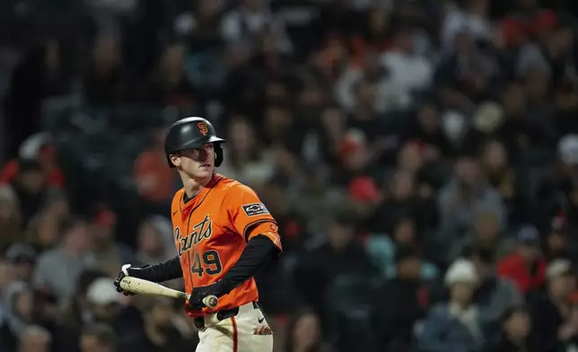 San Francisco Giants' Tyler Fitzgerald walks to the dugout after striking out during the fifth inning of the team's baseball game against the Pittsburgh Pirates, Friday, April 26, 2024, in San Francisco. (AP Photo/Godofredo A. Vásquez)