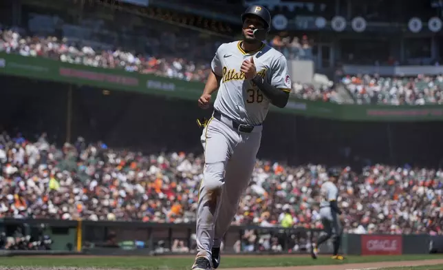 Pittsburgh Pirates' Edward Olivares scores against the San Francisco Giants on Jared Triolo's ground out during the fifth inning of a baseball game Sunday, April 28, 2024, in San Francisco. Edward Olivares scored on the play. (AP Photo/Godofredo A. Vásquez)