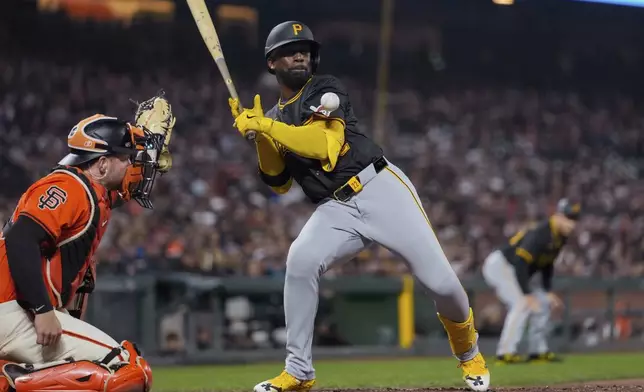 Pittsburgh Pirates' Andrew McCutchen, right, is hit by a pitch during the seventh inning of the team's baseball game against the San Francisco Giants, Friday, April 26, 2024, in San Francisco. (AP Photo/Godofredo A. Vásquez)