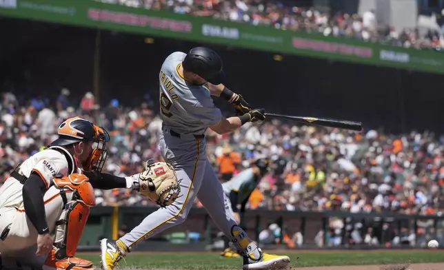 Pittsburgh Pirates' Jared Triolo, right, hits a groundout to San Francisco Giants shortstop Tyler Fitzgerald during the fifth inning of a baseball game Sunday, April 28, 2024, in San Francisco. Pirates' Edward Olivares scored on the play. (AP Photo/Godofredo A. Vásquez)