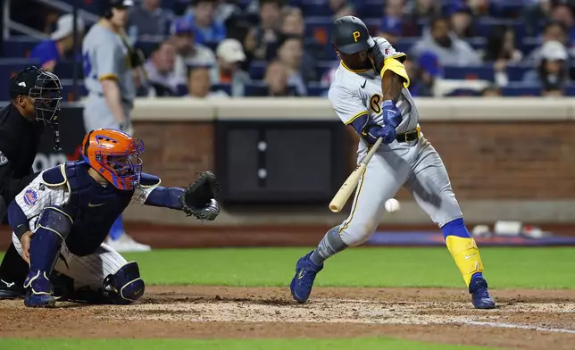 Pittsburgh Pirates' Andrew McCutchen, right, hits a single against the New York Mets during the sixth inning of a baseball game, Monday, April 15, 2024, in New York. (AP Photo/Noah K. Murray)