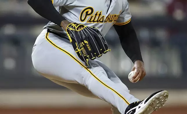 Pittsburgh Pirates pitcher Aroldis Chapman winds up to throw against the New York Mets during the eighth inning of a baseball game, Monday, April 15, 2024, in New York. (AP Photo/Noah K. Murray)