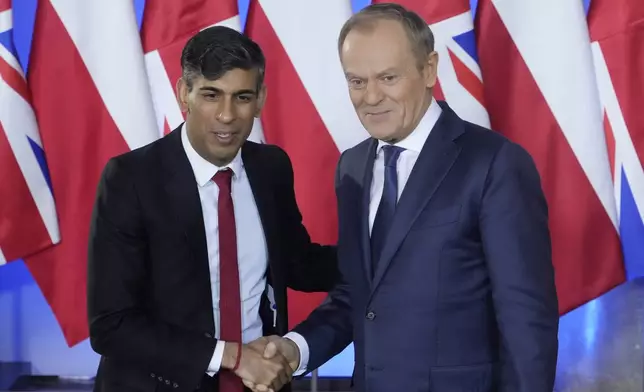 Polish Prime Minister Donald Tusk, right, and Britain's Prime Minister Rishi Sunak pose at the Prime Minister Office in Warsaw, Poland, Tuesday, April 23, 2024. Sunak will hold talks with Tusk and Stoltenberg that will focus on Ukraine and wider European security. (AP Photo/Czarek Sokolowski)