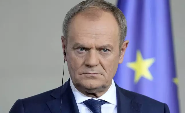 FILE - Poland's Prime Minister Donald Tusk listens to the media in Berlin, Germany, Friday, March 15, 2024. Tusk is celebrating a victory on Monday April 22, 2024 after a series of candidates supported by his party won weekend races for mayor. (AP Photo/Ebrahim Noroozi, File)