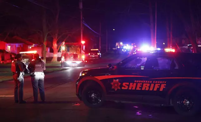 Police set up a perimeter after two officers were shot, in Salina, N.Y., Sunday, April 14, 2024. (Scott Schild/The Post-Standard via AP)