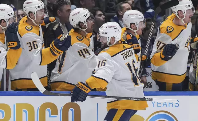 Nashville Predators' Jason Zucker (16) celebrates his goal against the Vancouver Canucks during the first period in Game 1 of an NHL hockey Stanley Cup first-round playoff series in Vancouver, British Columbia, on Sunday, April 21, 2024. (Darryl Dyck/The Canadian Press via AP)