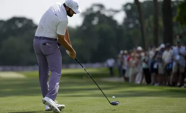 Scottie Scheffler hits his tee shot on the 10th hole during the third round of the RBC Heritage golf tournament, Saturday, April 20, 2024, in Hilton Head Island, S.C. (AP Photo/Chris Carlson)