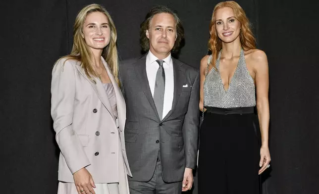 Lauren Bush Lauren, left, David Lauren and Jessica Chastain attend the Ralph Lauren Fall/Holiday 2024 presentation on Monday, April 29, 2024, in New York. (Photo by Evan Agostini/Invision/AP)