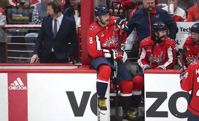 Washington Capitals left wing Alex Ovechkin (8) rests on the boards during a timeout during the second period against the New York Rangers in Game 3 of an NHL hockey Stanley Cup first-round playoff series, Friday, April 26, 2024, in Washington. (AP Photo/Tom Brenner)