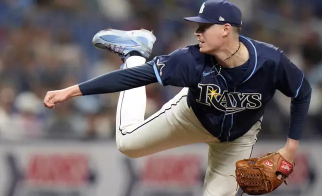 Tampa Bay Rays relief pitcher Pete Fairbanks follows through on a delivery to a Texas Rangers batter during the ninth inning of a baseball game Tuesday, April 2, 2024, in St. Petersburg, Fla. (AP Photo/Chris O'Meara)