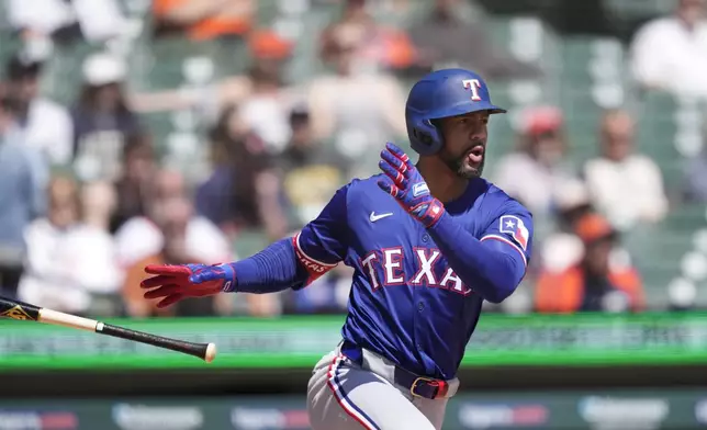 Texas Rangers' Marcus Semien connects for a RBI single to center during the fifth inning of a baseball game against the Detroit Tigers, Tuesday, April 16, 2024, in Detroit. (AP Photo/Carlos Osorio)