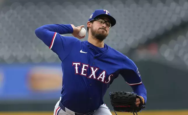 Texas Rangers pitcher Dane Dunning throws against the Detroit Tigers in the first inning of a baseball game, Wednesday, April 17, 2024, in Detroit. (AP Photo/Paul Sancya)