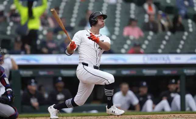 Detroit Tigers outfielder Kerry Carpenter (30) hits a home run against the Texas Rangers in the second inning of a baseball game, Wednesday, April 17, 2024, in Detroit. (AP Photo/Paul Sancya)