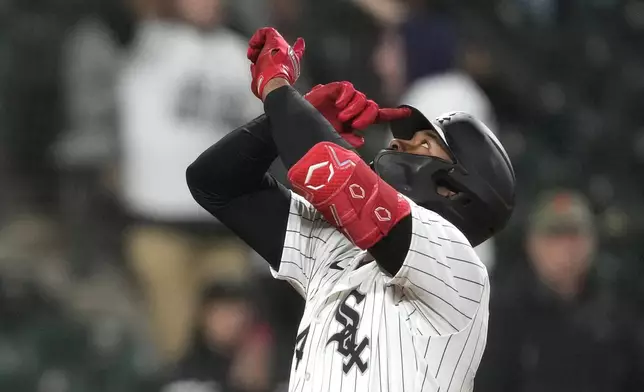 Chicago White Sox's Eloy Jiménez celebrates after his two-run home run during the seventh inning of a baseball game against the Tampa Bay Rays, Friday, April 26, 2024, in Chicago. (AP Photo/Charles Rex Arbogast)