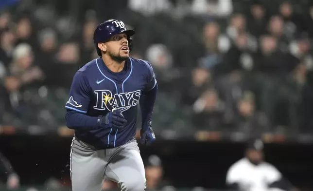 Tampa Bay Rays' René Pinto watches his RBI double off Chicago White Sox relief pitcher Deivi García during the seventh inning of a baseball game Friday, April 26, 2024, in Chicago. (AP Photo/Charles Rex Arbogast)