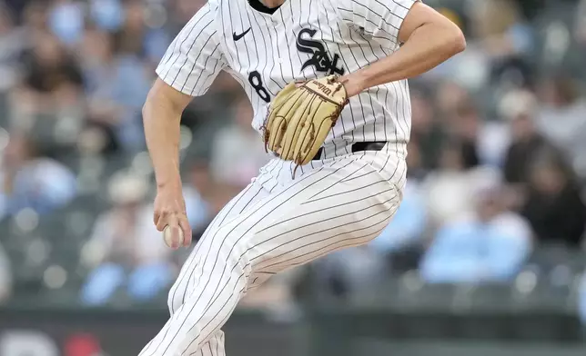 Chicago White Sox starting pitcher Jonathan Cannon winds up during the first inning of a baseball game against the Tampa Bay Rays, Saturday, April 27, 2024, in Chicago. (AP Photo/Charles Rex Arbogast)