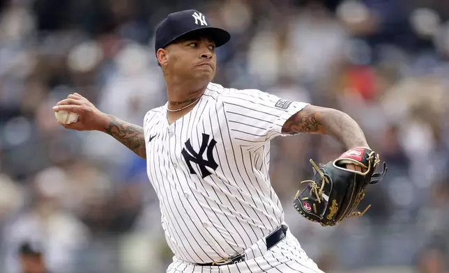 New York Yankees pitcher Luis Gil throws against the Tampa Bay Rays during the third inning of a baseball game Sunday, April 21, 2024, in New York. (AP Photo/Adam Hunger)