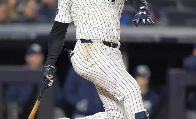 New York Yankees' Juan Soto follows through on a three-run home run during the seventh inning of a baseball game against the Tampa Bay Rays, Friday, April 19, 2024, in New York. (AP Photo/Frank Franklin II)