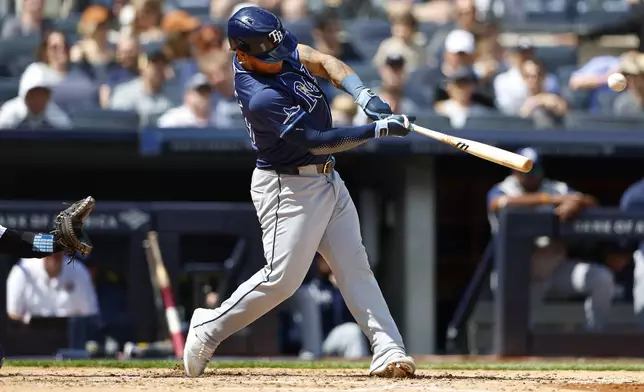 Tampa Bay Rays' Harold Ramírez (43) hits a single during the sixth inning inning of a baseball game against the New York Yankees, Saturday, April 20, 2024 in New York. (AP Photo/Noah K. Murray)
