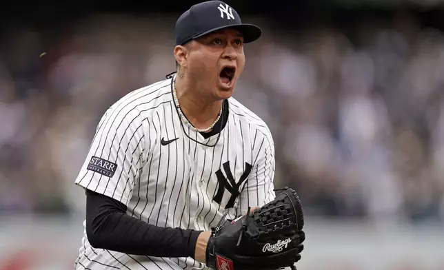 New York Yankees pitcher Victor González reacts after throwing out Tampa Bay Rays' Harold Ramírez to end the ninth inning of a baseball game Sunday, April 21, 2024, in New York. (AP Photo/Adam Hunger)