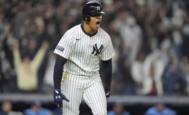 New York Yankees' Juan Soto celebrates after hitting a three-run home run during the seventh inning of a baseball game against the Tampa Bay Rays, Friday, April 19, 2024, in New York. (AP Photo/Frank Franklin II)