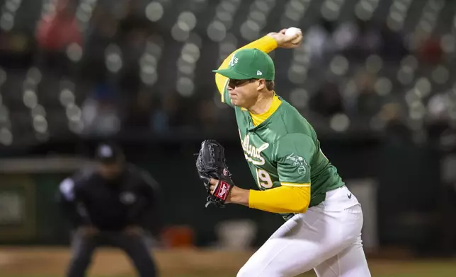 Oakland Athletics starting pitcher Mason Miller (19) pitches during the ninth inning of a baseball game against the Boston Red Sox, Tuesday, April 2, 2024, in Oakland, Calif. (AP Photo/Nic Coury)