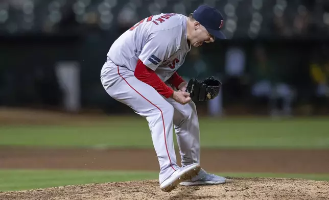 Boston Red Sox relief pitcher Josh Winckowski celebrates a save to win the game in the 11th inning of a baseball game against the Oakland Athletics, Tuesday, April 2, 2024, in Oakland, Calif. (AP Photo/Nic Coury)