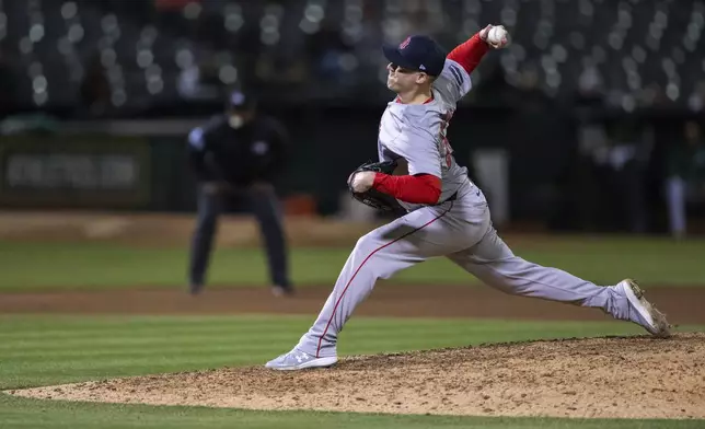 Boston Red Sox relief pitcher Josh Winckowski throws during the 11th inning of the team's baseball game against the Oakland Athletics, Tuesday, April 2, 2024, in Oakland, Calif. (AP Photo/Nic Coury)