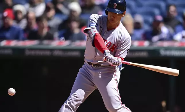 Boston Red Sox's Masataka Yoshida swings during the fifth inning of a baseball game against the Cleveland Guardians, Thursday, April 25, 2024, in Cleveland. (AP Photo/David Dermer)