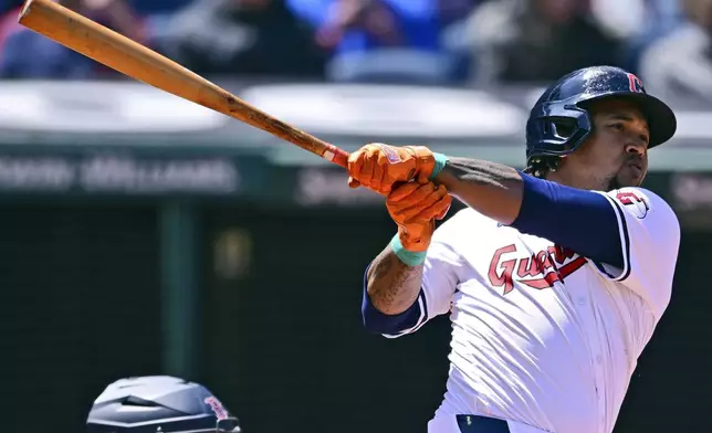 Cleveland Guardians' Jose Ramirez watches the ball after hitting a grand slam off Boston Red Sox starting pitcher Chase Anderson during the second inning of a baseball game, Thursday, April 25, 2024, in Cleveland. (AP Photo/David Dermer)