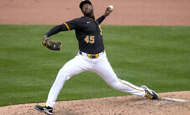 Pittsburgh Pirates relief pitcher Aroldis Chapman delivers during the eighth inning of the team's baseball game against the Boston Red Sox in Pittsburgh, Sunday, April 21, 2024. (AP Photo/Gene J. Puskar)