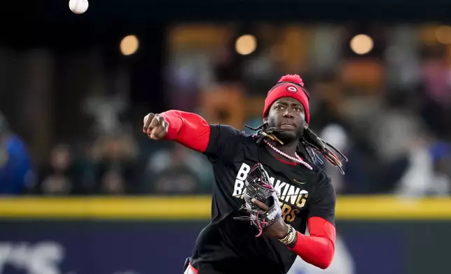 Cincinnati Reds shortstop Elly De La Cruz wears a shirt for Jackie Robinson Day during batting practice before a baseball game against the Seattle Mariners, Monday, April 15, 2024, in Seattle. (AP Photo/Lindsey Wasson)