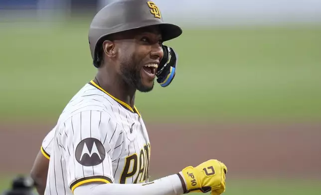 San Diego Padres' Jurickson Profar celebrates after hitting a home run during the first inning of a baseball game against the Cincinnati Reds, Monday, April 29, 2024, in San Diego. (AP Photo/Gregory Bull)