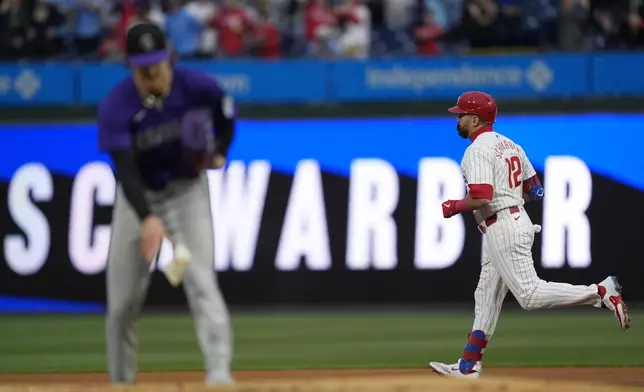 Philadelphia Phillies' Kyle Schwarber runs the basses after hitting a home run off of Colorado Rockies pitcher Ryan Feltner during the first inning of a baseball game, Wednesday, April 17, 2024, in Philadelphia. (AP Photo/Matt Rourke)