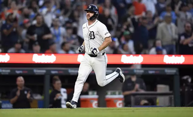 Detroit Tigers' Jake Rogers scores against the Kansas City Royals during the seventh inning of a baseball game Saturday, April 27, 2024, in Detroit. (AP Photo/Jose Juarez)
