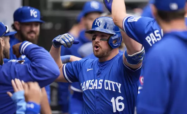 Kansas City Royals' Hunter Renfroe celebrates in the dugout after hitting a home run during the ninth inning in the first baseball game of a doubleheader against the Chicago White Sox, Wednesday, April 17, 2024, in Chicago. (AP Photo/Erin Hooley)