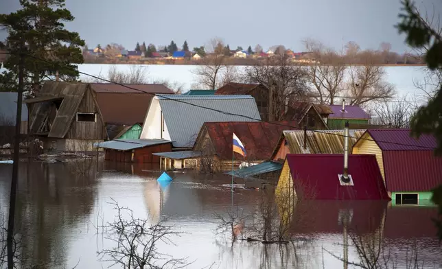 A view of a flooded area in Ishim, Tyumen region, 1968 km (1230 miles) east of Moscow, Russia, on Sunday, April 21, 2024. The situation with floods in Russia's Tyumen Region remains tense, with the level of water in the Ishim River having exceeded 10.5 meters, (AP Photo/Sergei Rusanov)