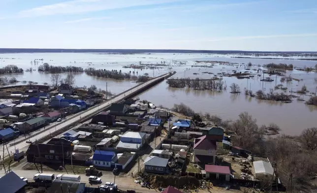 An aerial view of a flooded area in Ishim, Tyumen region, 1968 km (1230 miles) east of Moscow, Russia, on Monday, April 22, 2024. The situation with floods in Russia's Tyumen Region remains tense, with the level of water in the Ishim River having exceeded 10.5 meters. (AP Photo/Sergei Rusanov)