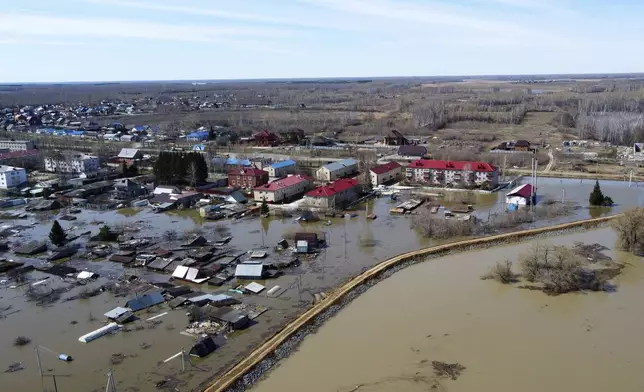 An aerial view of a flooded area in Ishim, Tyumen region, 1968 km (1230 miles) east of Moscow, Russia, on Monday, April 22, 2024. The situation with floods in Russia's Tyumen Region remains tense, with the level of water in the Ishim River having exceeded 10.5 meters. (AP Photo/Sergei Rusanov)