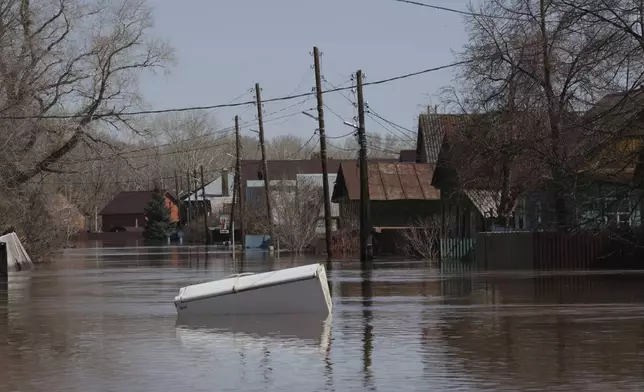 A refrigerator floats in a flooded area in Orenburg, Russia, on Thursday, April 11, 2024. Russian officials are scrambling to help homeowners displaced by floods, as water levels have risen in the Ural River. The river's water level in the city of Orenburg was above 10 meters (33 feet) Wednesday, state news agency Ria Novosti reported, citing the regional governor. (AP Photo)