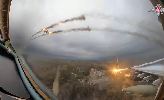 FILE – A Su-25 plane is seen firing rockets over Ukraine in a video frame grab. The video was taken from inside another Su-25 plane and released by the Russian Defense Ministry on Jan. 22, 2024. (Russian Defense Ministry Press Service via AP, File)