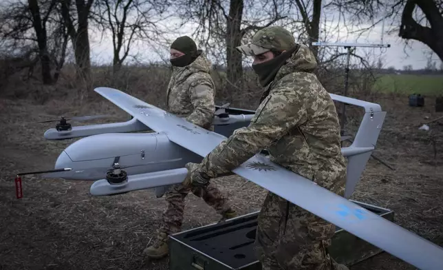 FILE - Ukrainian soldiers with the 22nd Mechanized Brigade prepare to launch the Poseidon H10 Middle-range drone near the city of Bakhmut in Ukraine’s Donetsk region on March 26, 2024. (AP Photo/Efrem Lukatsky, File)