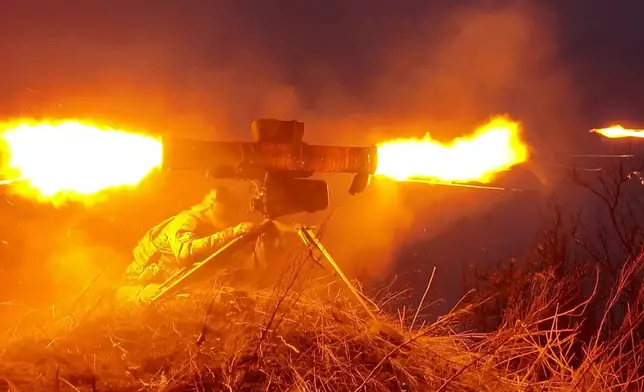 FILE - In this video frame grab released by the Russian Defense Ministry on March 26, 2024, a Russian soldier in an undisclosed location fires an anti-tank missile at Ukrainian forces. Russian troops have been ramping up pressure on exhausted Ukrainian forces across the front line to prepare to take more land this spring and summer. (Russian Defense Ministry Press Service photo via AP, File)