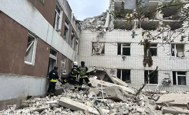 In this photo provided by the Ukrainian Emergency Service, rescuers work at the site of a Russian missile strike in Chernihiv, Ukraine, Wednesday, April 17, 2024. (Ukrainian Emergency Service via AP Photo)