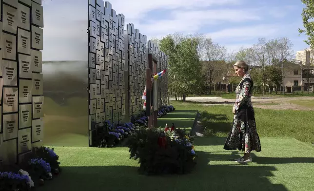 Britain's Sophie, Duchess of Edinburgh, visits the memorial to the victims of the Russian occupation in the town of Bucha, Ukraine, Monday, April 29, 2024. (Anatolii Stepanov/Pool via AP)